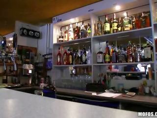 Barmaid Lenka railed in the bar for cash