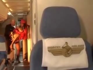 Desiring stewardess rides a phallus inside both holes