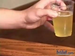 Sabrina is pissing into a glass