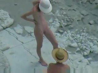 偷窺 性別 夾 上 該 海灘