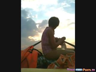 Amateur teens make a sextape in a boat on the lake show