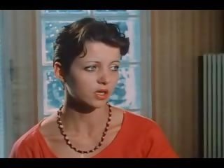 A brunette with small tits fucks two guys in vintage dirty movie