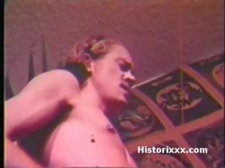 Busty femme fatale sucks huge pecker and gets facial in vintage clip