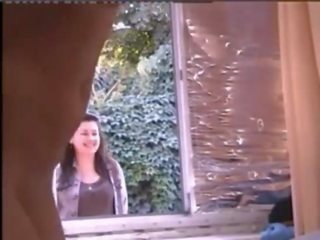 Damsel naked in window while people pass hahaha