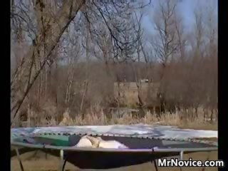 Iki adam have kirli movie outdoors on a trampoline