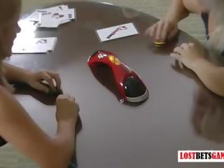 Two girls play strip air hockey