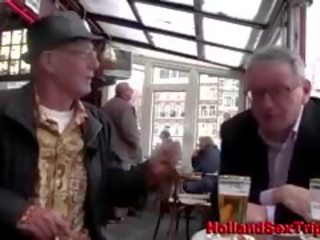 Fancy woman with old dude in red light district