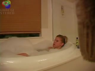 Sedusive blond teenager kejiret playing with herself in the bath