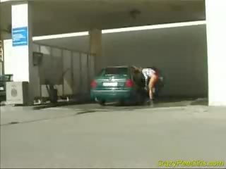 Crazy pee schoolgirl at the car wash